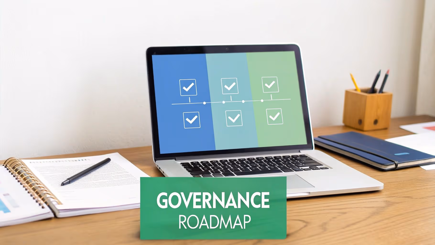 A laptop on a wooden desk displays a governance roadmap timeline, with a green banner saying GOVERNANCE ROADMAP.