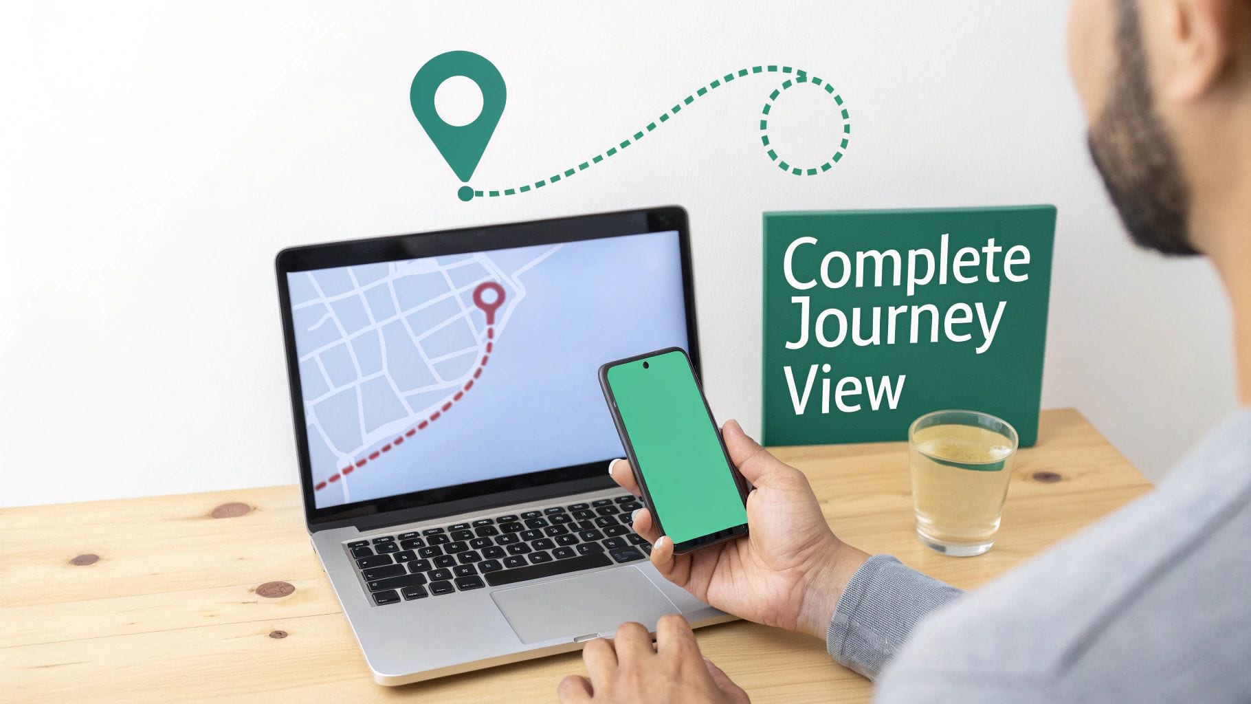 A person views a map showing a journey on a laptop and smartphone, with 'Complete Journey View' text.