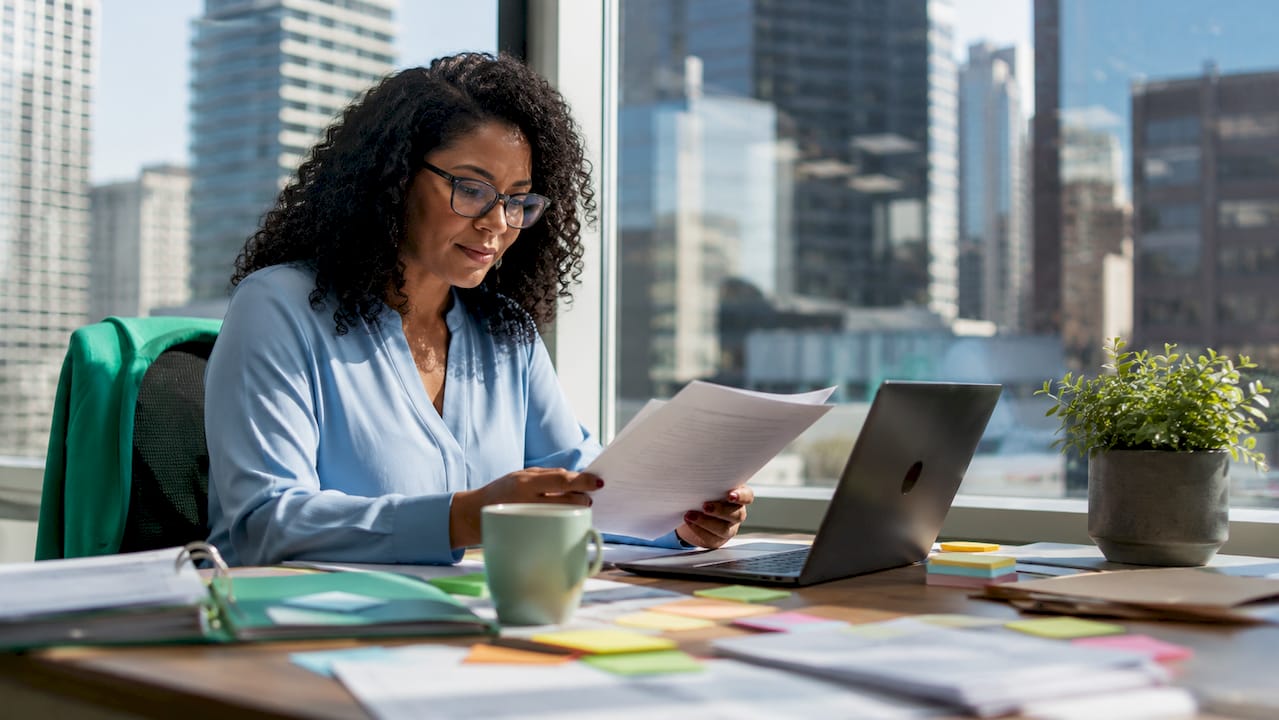 Data analyst reviewing data schema documents