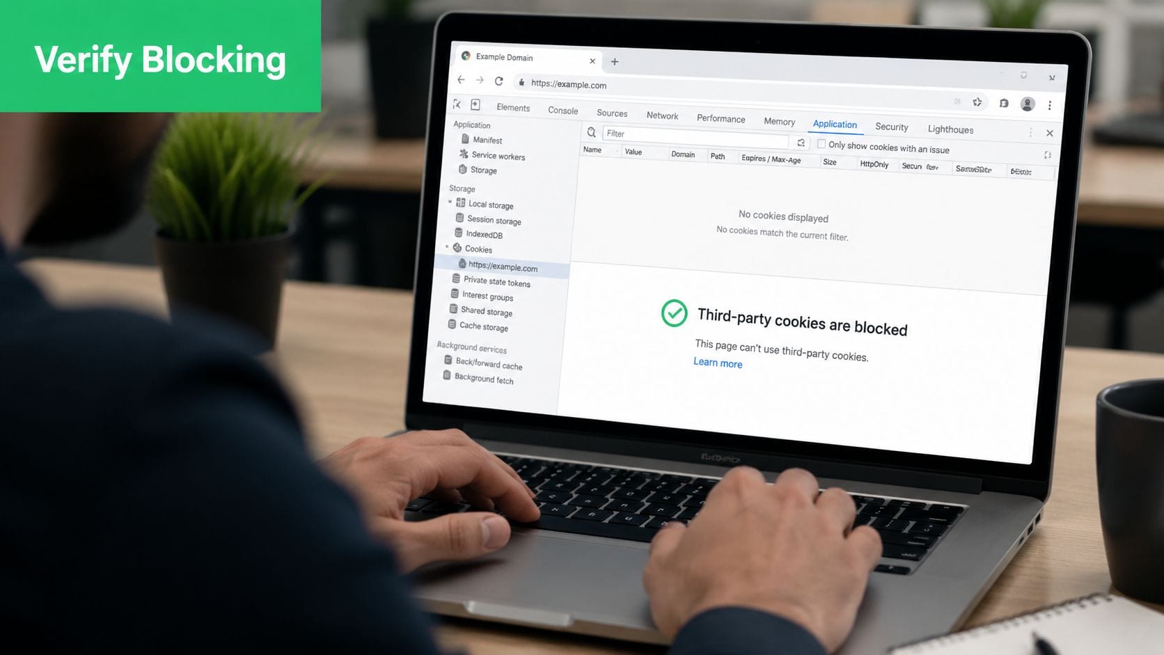 A person using a laptop to view browser settings showing that third-party cookies are currently being blocked.