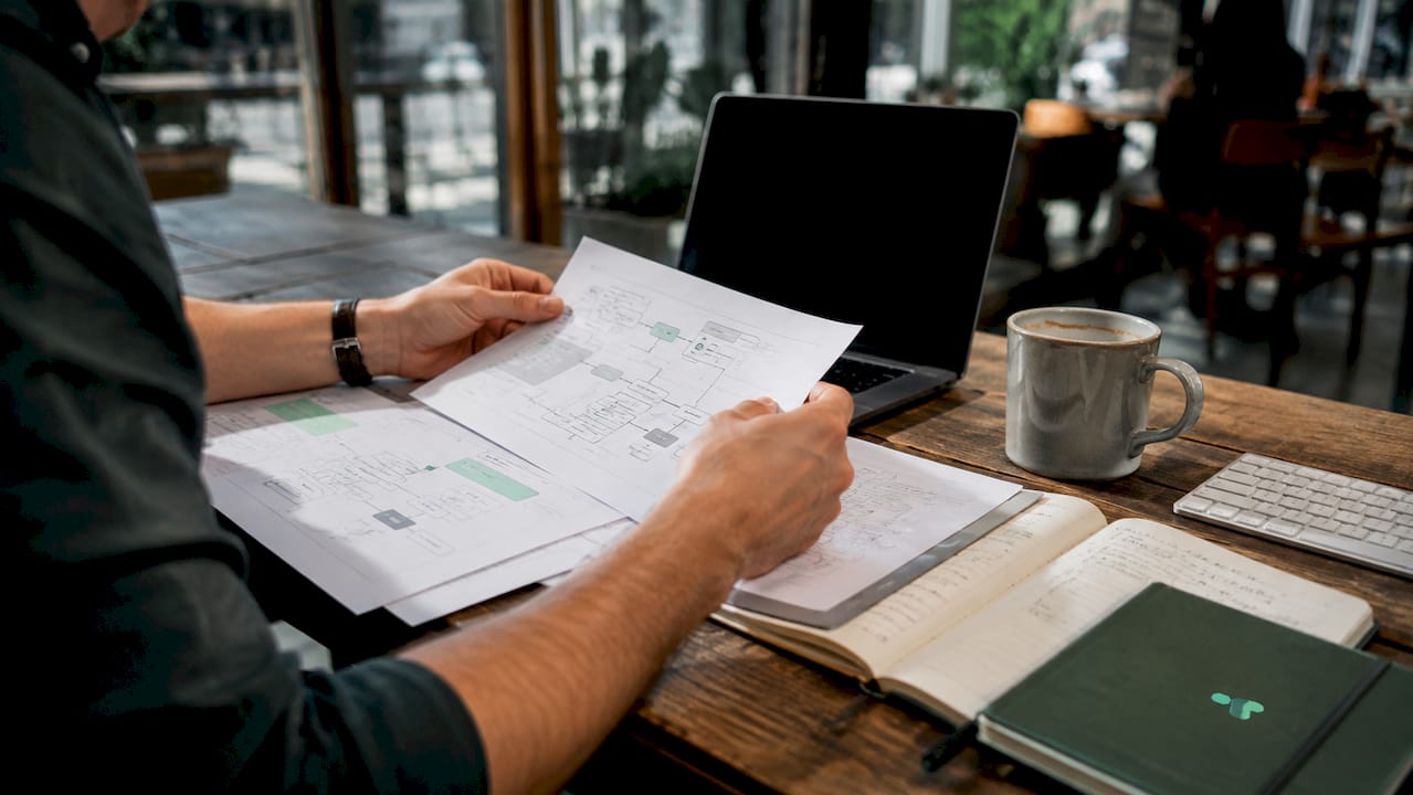 Hands reviewing martech integration documents